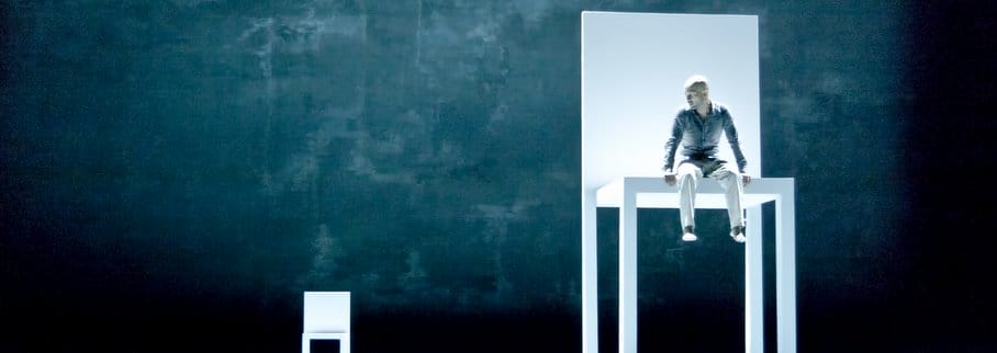 Akram Khan sitting in a giant chair.